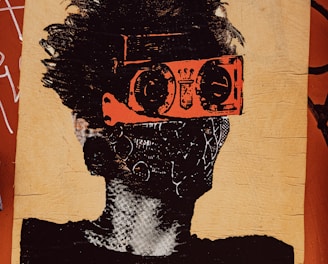A stylized piece of street art depicts a person with wild hair. The character wears bright orange goggles and a patterned mask, giving a futuristic or rebellious vibe. The background is a textured brown surface with graffiti and the word 'SPORT' partially visible in bold letters.